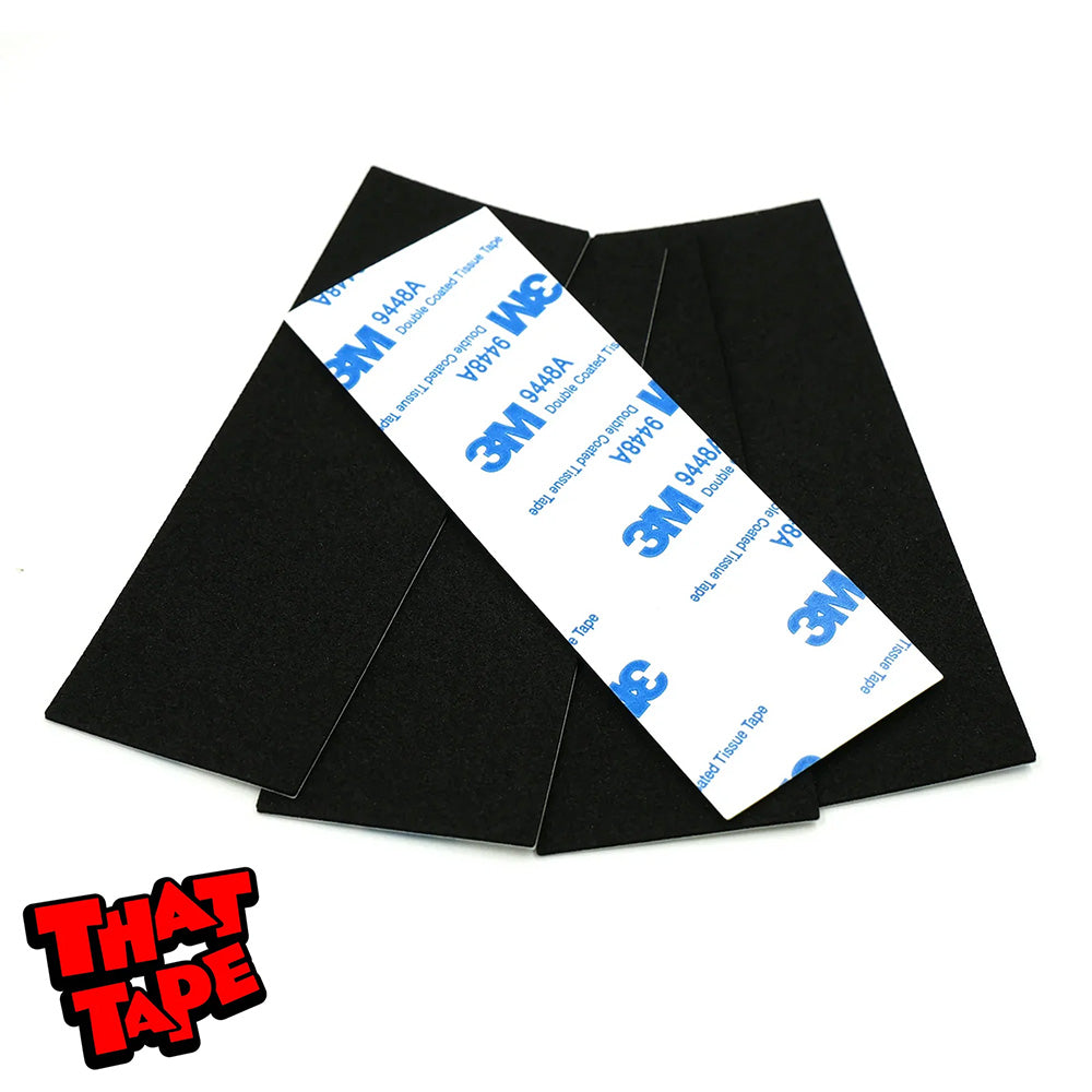 The SLUSHCULT THAT TAPE FINGERBOARD FOAM GRIP 5 PACK includes five black rectangular adhesive strips—one flipped to reveal the 3M backing. The "That Tape" logo is shown in the bottom left corner.
