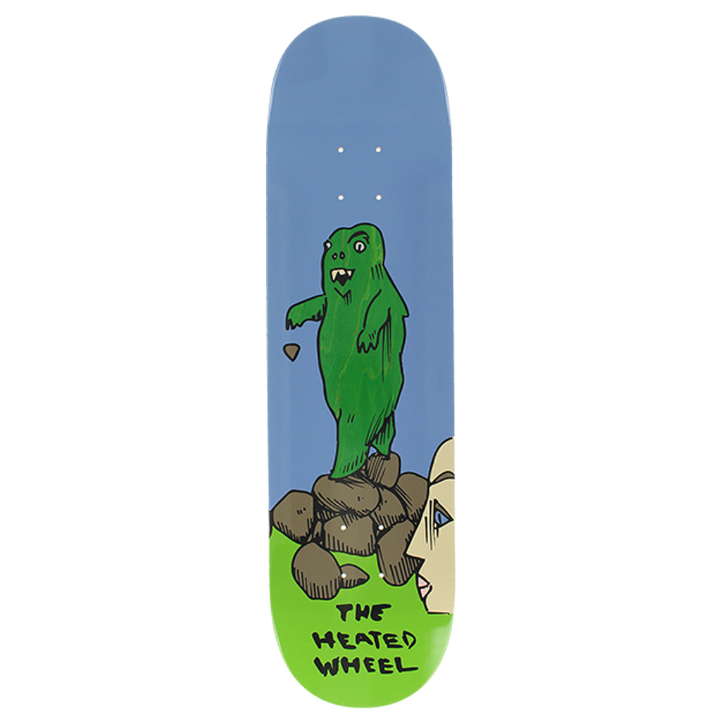 A THE HEATED WHEEL skateboard deck with a green monster on top of rocks, featuring various stain options for a unique look.