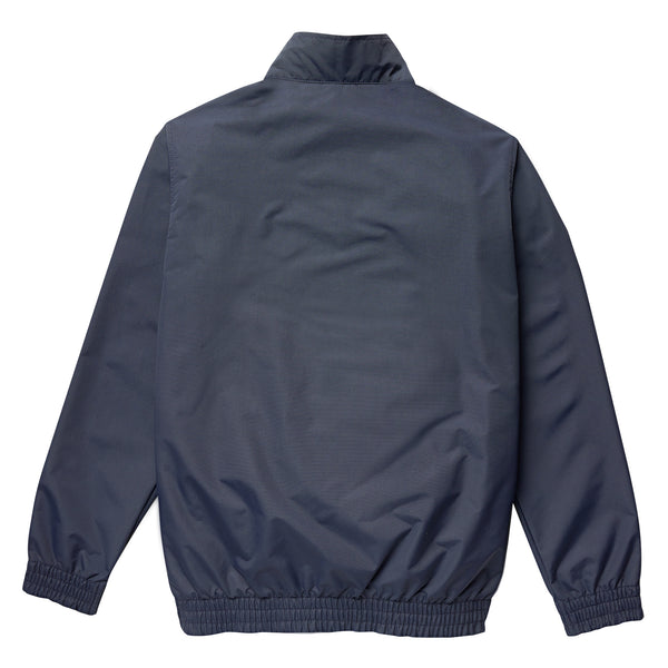 A back view of a navy blue Dickies Guy Mariano jacket isolated on a white background.
