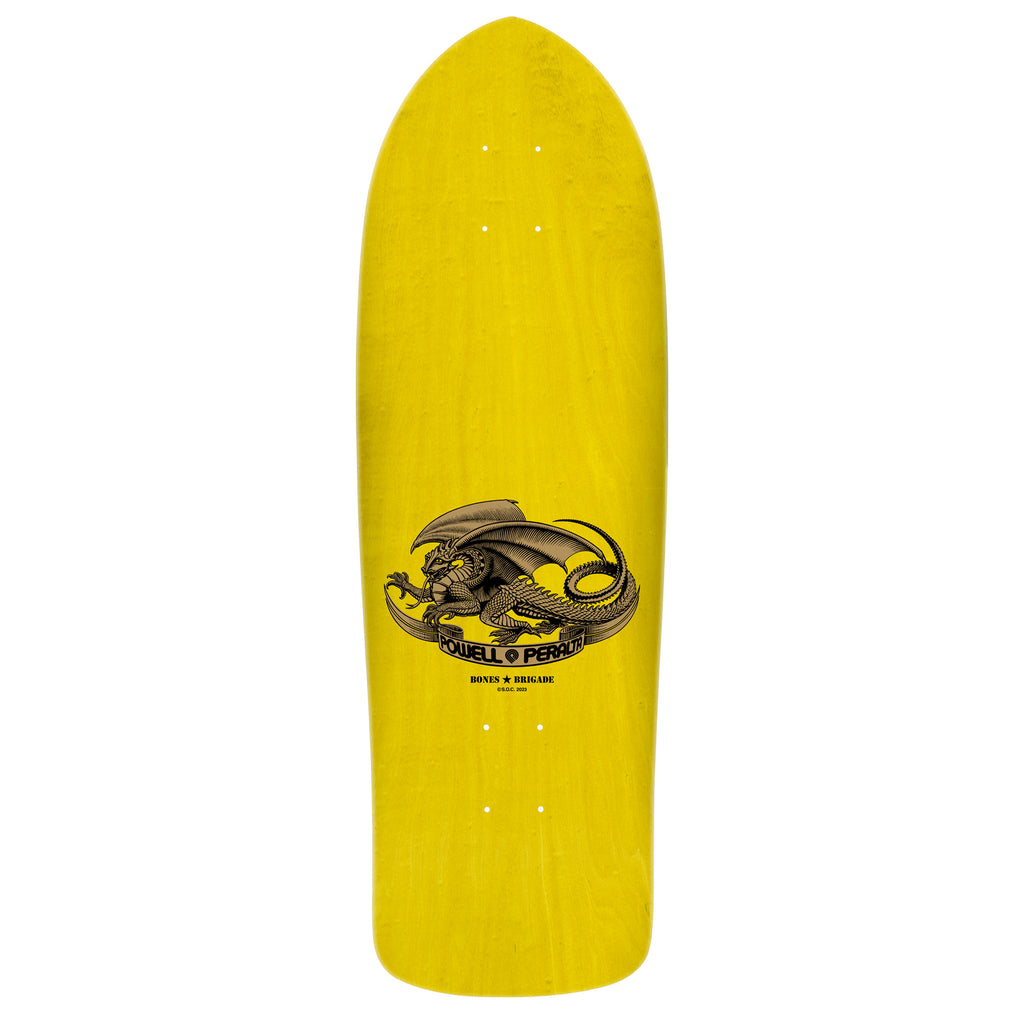 A yellow Powell Peralta skateboard deck with a central graphic of a coiled dragon and text from the POWELL PERALTA BONES BRIGADE SERIES 15 GUERRERO.