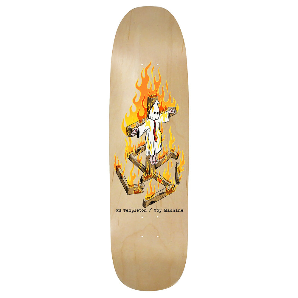 The DELUXE TOY MACHINE ED TEMPLETON CHARRED CROSS skateboard deck features a ghostly figure tied to a burning cross, with "Ed Templeton / Toy Machine" text below.