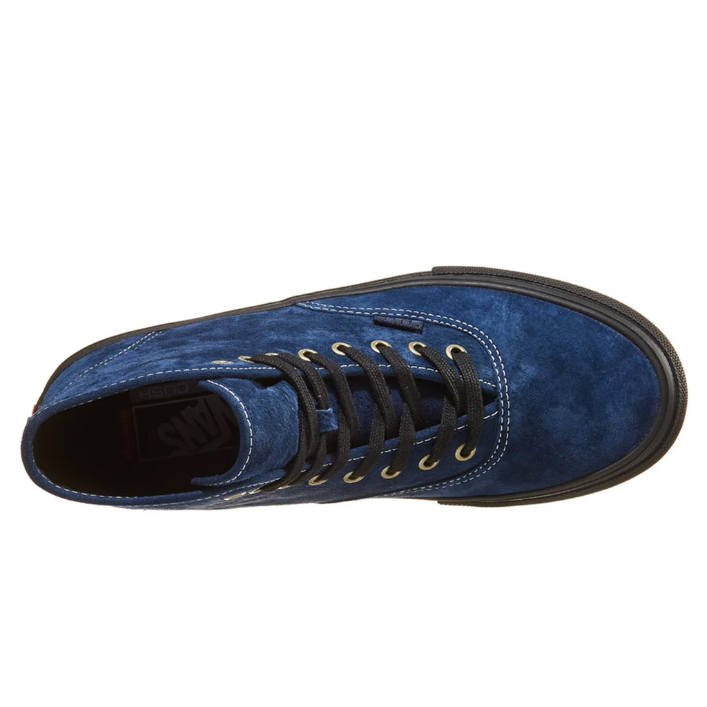 The top view of a blue suede shoe with black laces.