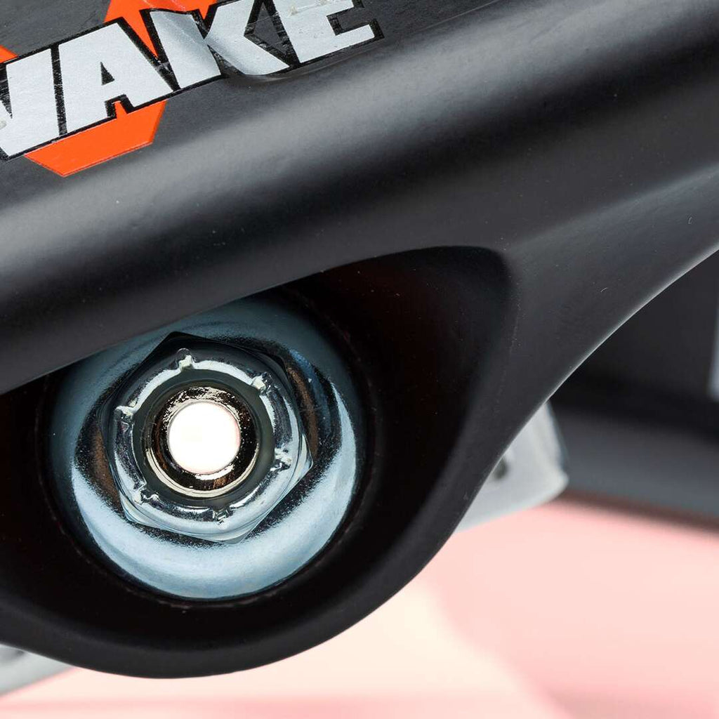 Close-up of a skateboard truck from the VENTURE HOLLOWS "WIDE AWAKE" 5.6 set, featuring a visible bolt and partial logo reading "WAKE." The polished hanger is equipped with 90D bushings for superior performance, securely attached to the skateboard deck.