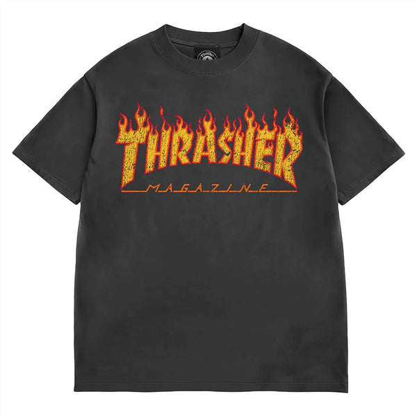 The THRASHER FLAME VINTAGE TEE BLACK features the iconic yellow and red "Thrasher Magazine" flame logo across the chest, perfect for fans of classic Thrasher style.