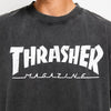 Close-up of a person wearing the THRASHER MAG LOGO VINTAGE TEE BLACK by THRASHER, featuring the iconic white Thrasher Mag Logo printed on the front.