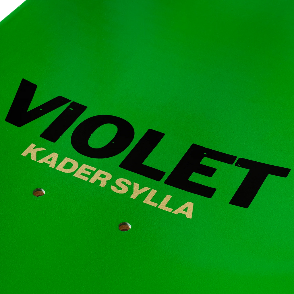 A close up of the text on the top of the lime green deck that reads "VIOLET KADER SYLLA".