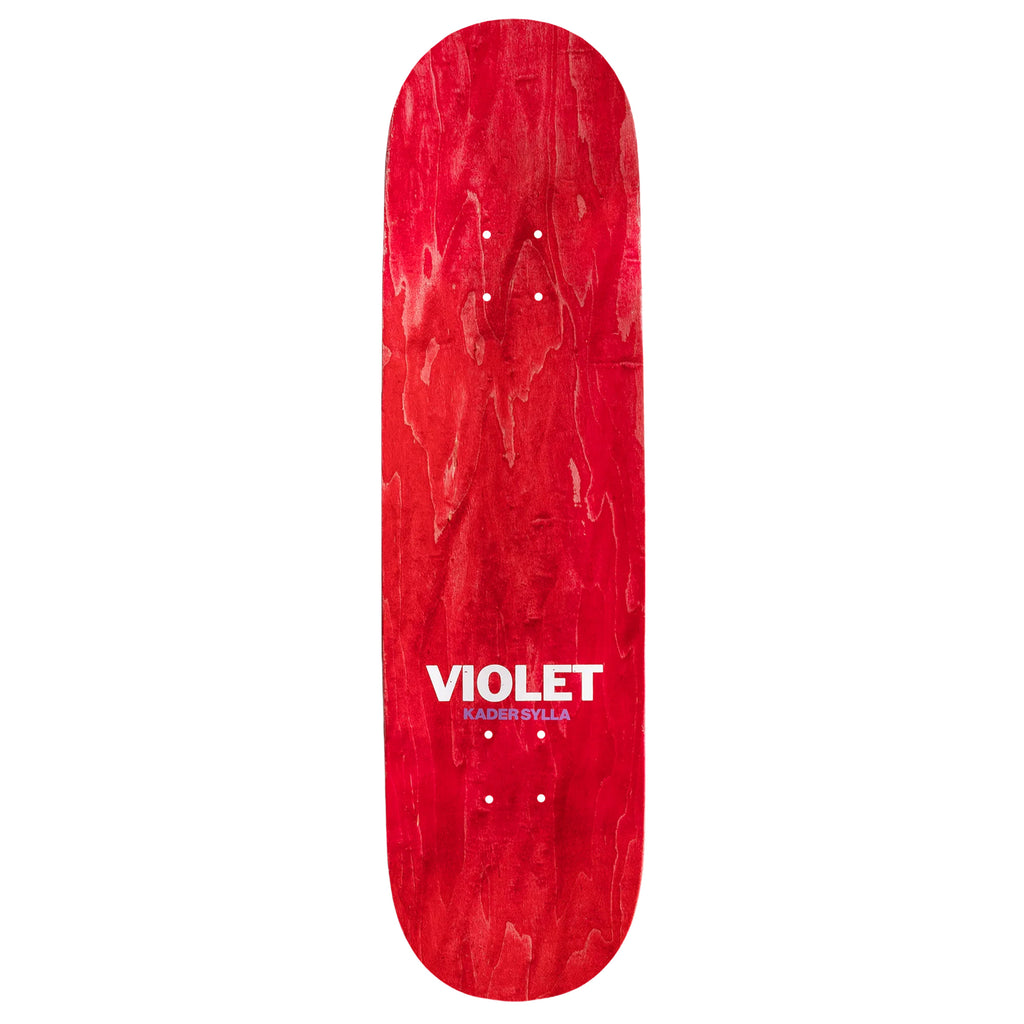 The top red stain of a skateboard deck that has printed the words "Violet Kader Sylla".