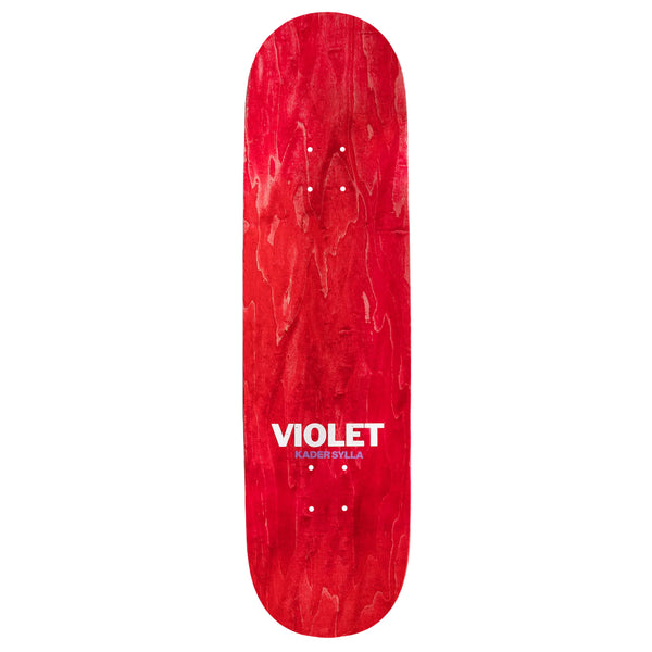 The top red stain of a skateboard deck that has printed the words "Violet Kader Sylla".