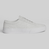 The WARSAW LTD CHAPTER | WHITE / WHITE is a white low-top sneaker with laces, side perforations, and a plain rubber sole, featuring a minimalistic silhouette shown in side profile against a light background.
