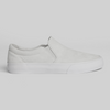 The STRANGER SLIP-ON | WHITE / WHITE by WARSAW LTD features a minimalistic, classic skate-inspired design with an all-white slip-on silhouette and rubber sole, showcased against a plain light gray background.