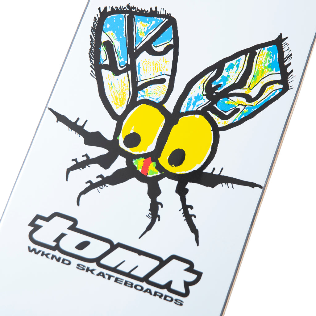 The WKND TOM K GOLD BLOOM skateboard features a Sarah Meurle Pro Model deck with an eye-catching image of a bug, complemented by wheel well cut-outs for added performance.
