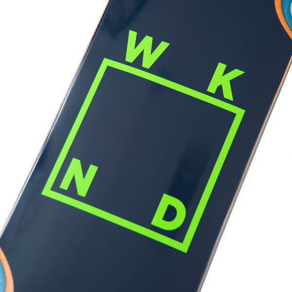 The WKND skateboard features sleek navy and green logo wheel wells, with the standout word "WKND" displayed prominently.