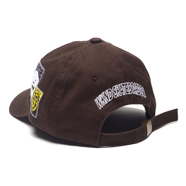 The WKND Eddy Hat Brown by WKND features embroidery—including "WIND SKATEBOARDS" on the back—plus an adjustable strap and metal clasp for a perfect fit.