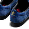 Close-up of the heel on the ADIDAS X ARROW & BEAST SUPERSTAR ADV NIGHT MARINE / CORE BLACK, showing woven blue texture, gold ADIDAS logo, red lining, and a durable black cupsole.