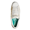 Top view of the ADIDAS X ARROW & BEAST SUPERSTAR ADV in Wonder White/Crystal White, featuring a shell toe, white laces, cupsole construction, and a green insole with the Adidas logo and geometric pattern.