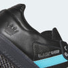 Close-up of the ADIDAS X CLTFC X BLACK SHEEP SAMBA ADV in Core Black, Cloud White, and Ice Blue, crafted from full-grain leather. The sneaker features a light blue stripe, an embossed crown emblem on the heel, and "BLACK SHEEP" text on the side.