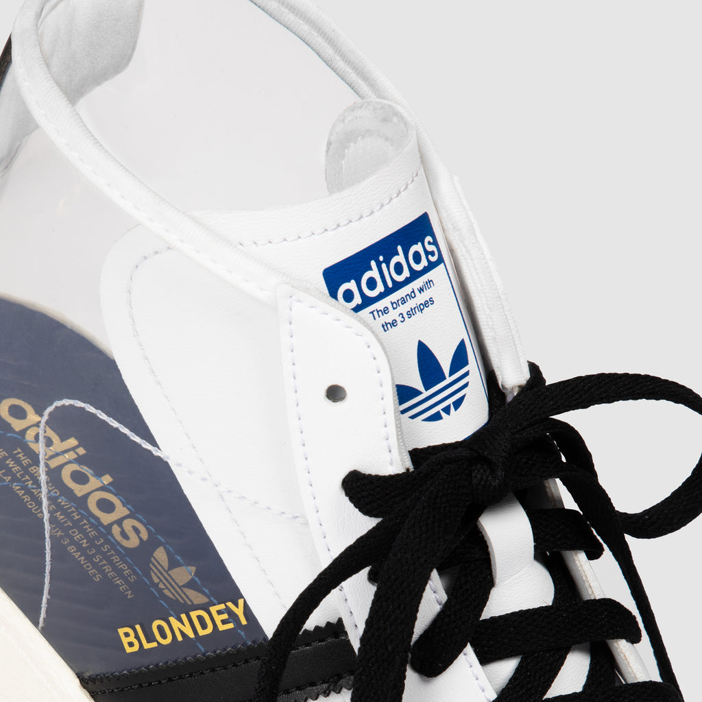 A pair of white and black ADIDAS BLONDEY PRO MODEL WHITE sneakers with a white sole.