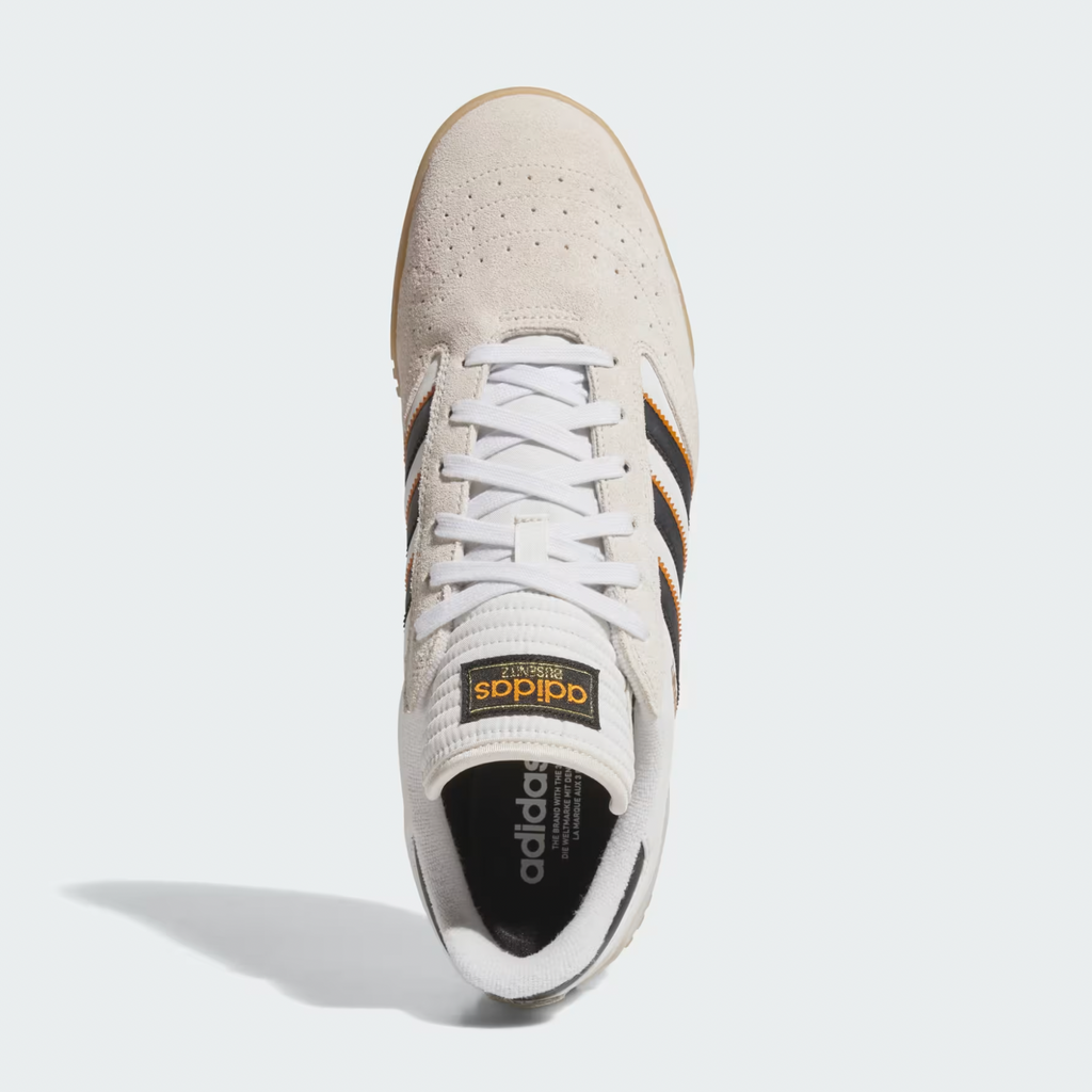 Top view of an ADIDAS Busenitz Indoor Super sneaker in Bliss, Core Black, and Off White with a durable leather upper, white laces, and tan suede toe.