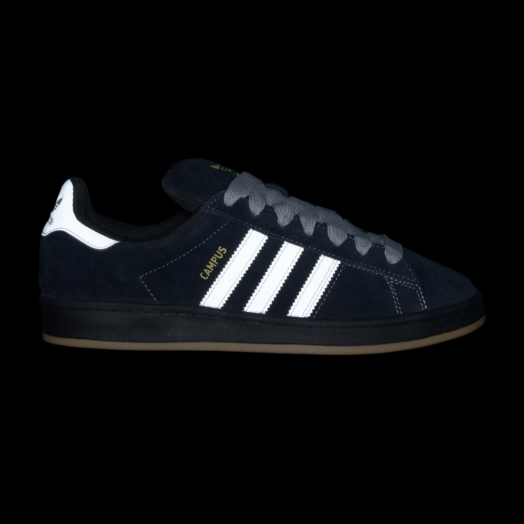 Henry Jones favors the sophisticated Adidas Campus 90s ADV sneaker, which highlights classic grey stripes and a gold metallic touch against a core black background.