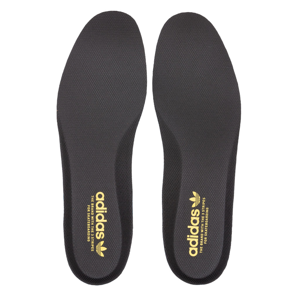 A pair of black ADIDAS PRO SHELL ADV X HEITOR DARK BROWN / CORE BLACK skateboarding shoes displayed against a white background, showing the brand logo in gold at the heel area.