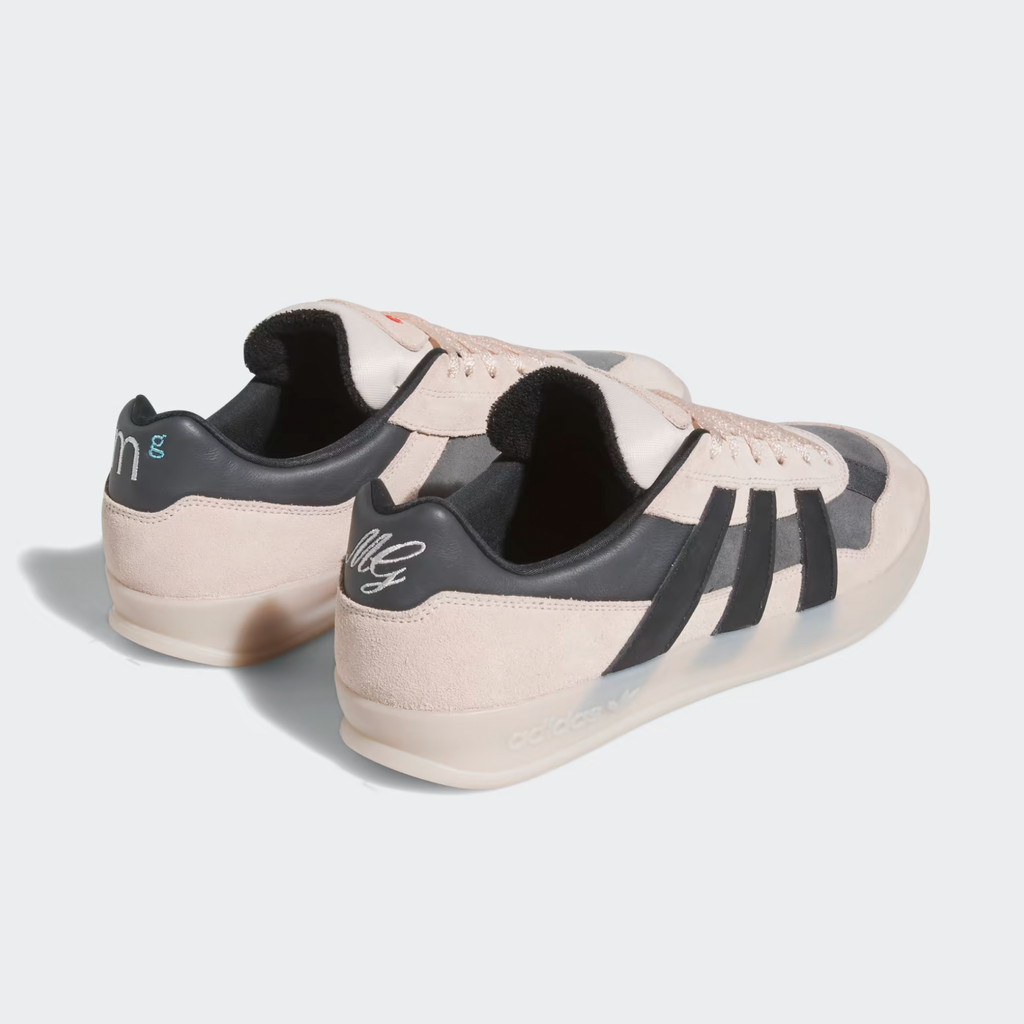 A pair of ADIDAS GONZ ALOHA SUPER WONDER QUARTZ / CORE BLACK / GREY SIX sneakers with black and white stripes.