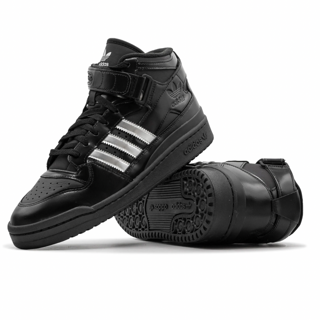 a pair black leather adidas forum 84 mid top with metallic silver adidas stripes and black rubber soles
