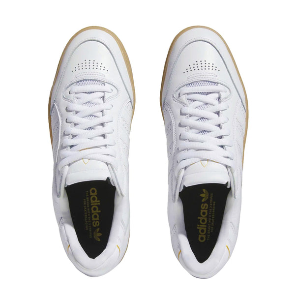 White leather Tyshawn Adidas Skate shoes with black insoles that have gold adidas branding on them