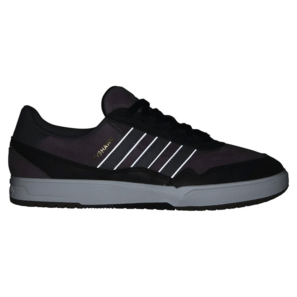 A black Adidas Tyshawn II Night Fig sneaker with three white stripes, a gray sole, and "CAMPUS" written in gold on the side. Featuring cupsole construction, these skateboarding shoes offer both style and durability.