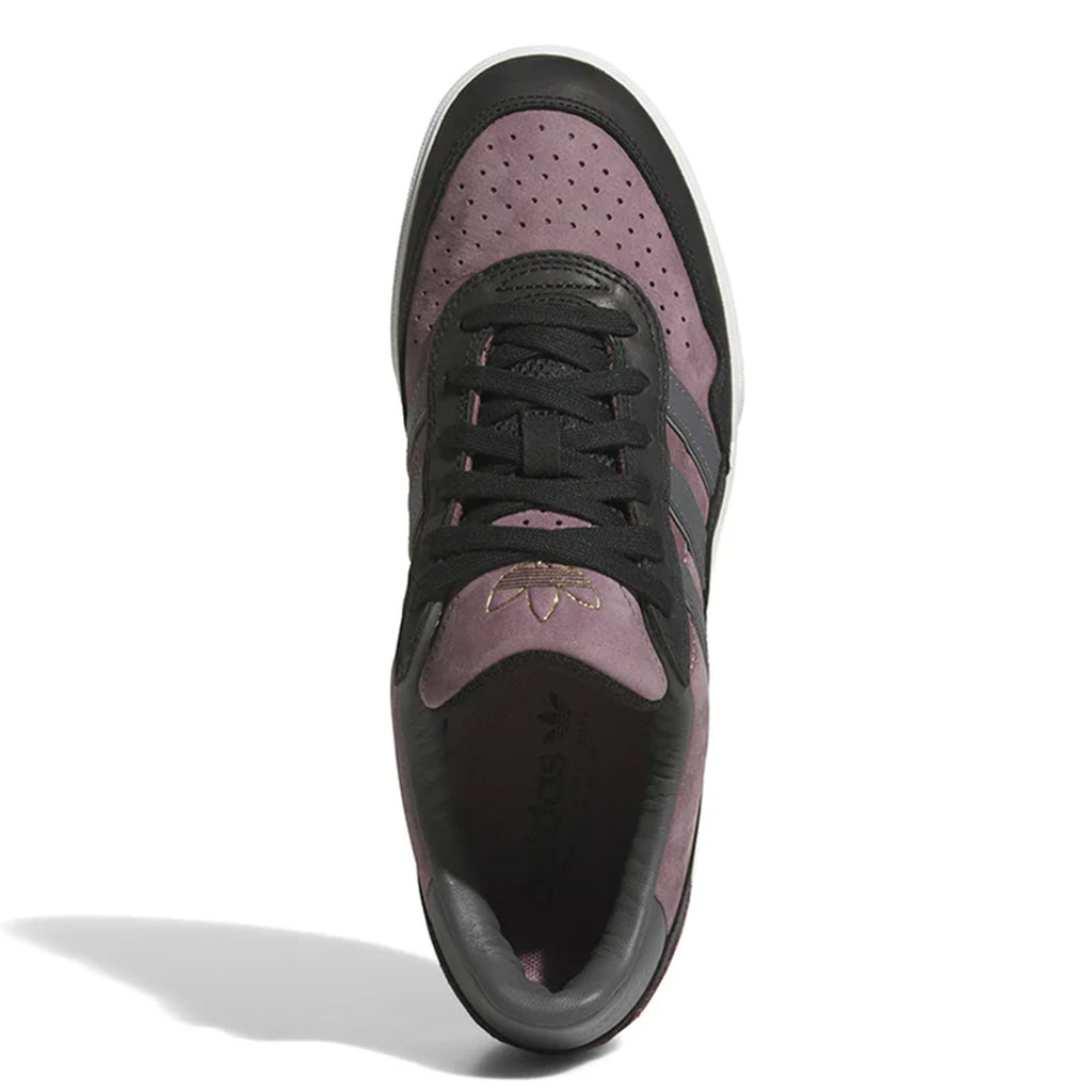 Top view of the ADIDAS TYSHAWN 2 NIGHT FIG / GREY / BLACK, an athletic sneaker in black and purple with laces and perforations on the toe area, featuring a logo on the tongue. The shoe boasts cupsole construction, making it ideal for skateboarding.