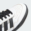 Close-up of the toe area of a white ADIDAS TYSHAWN 2 CRYSTAL WHITE / CORE BLACK / CHARCOAL SOLID GREY sneaker with black laces, CORE BLACK and white stripes on the side, and perforated detailing on the upper.