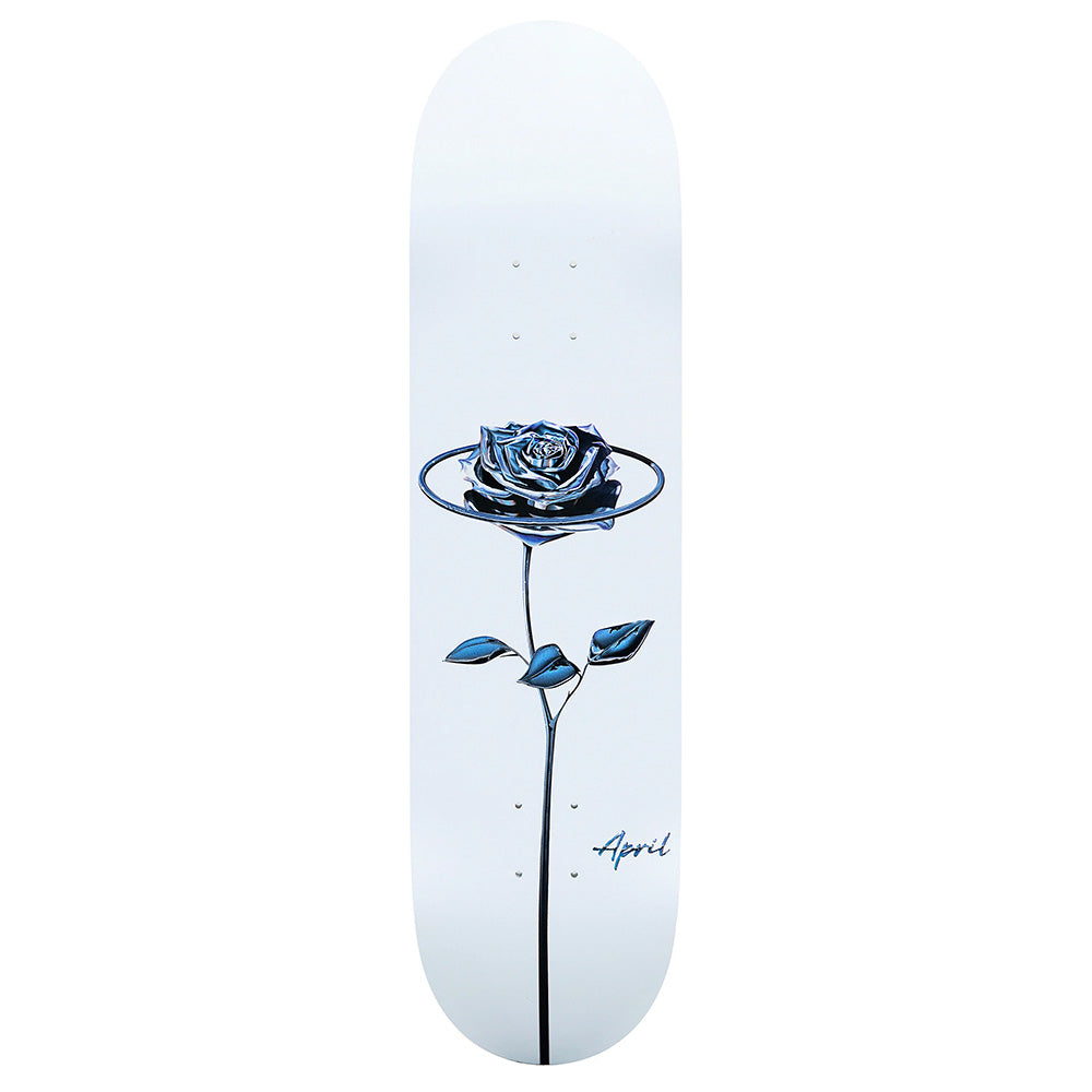 The APRIL CHROME ROSE WHITE skateboard deck by APRIL measures 32.2 x 8.5 and features a chrome rose in a ring on a white background with stem, two leaves, and "April" written near the bottom.