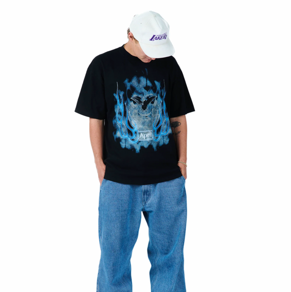 Shane O Neill is seen wearing the April Skull tee, the baggy style of the shirt is displayed as the shirt appears a bit over sized on Shane