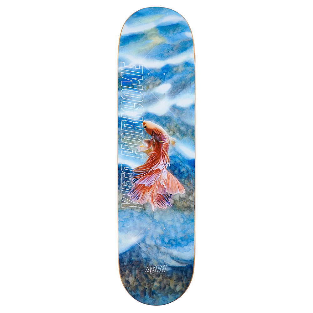 The APRIL YUTO TROPICAL 8.25" skateboard deck by APRIL features a vibrant tropical design with an orange fish swimming in blue water, white streaks, and island vibes for your ride.