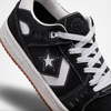 A black and white CONVERSE CONS ALEXIS AS-1 PRO sneaker with a star on the side.