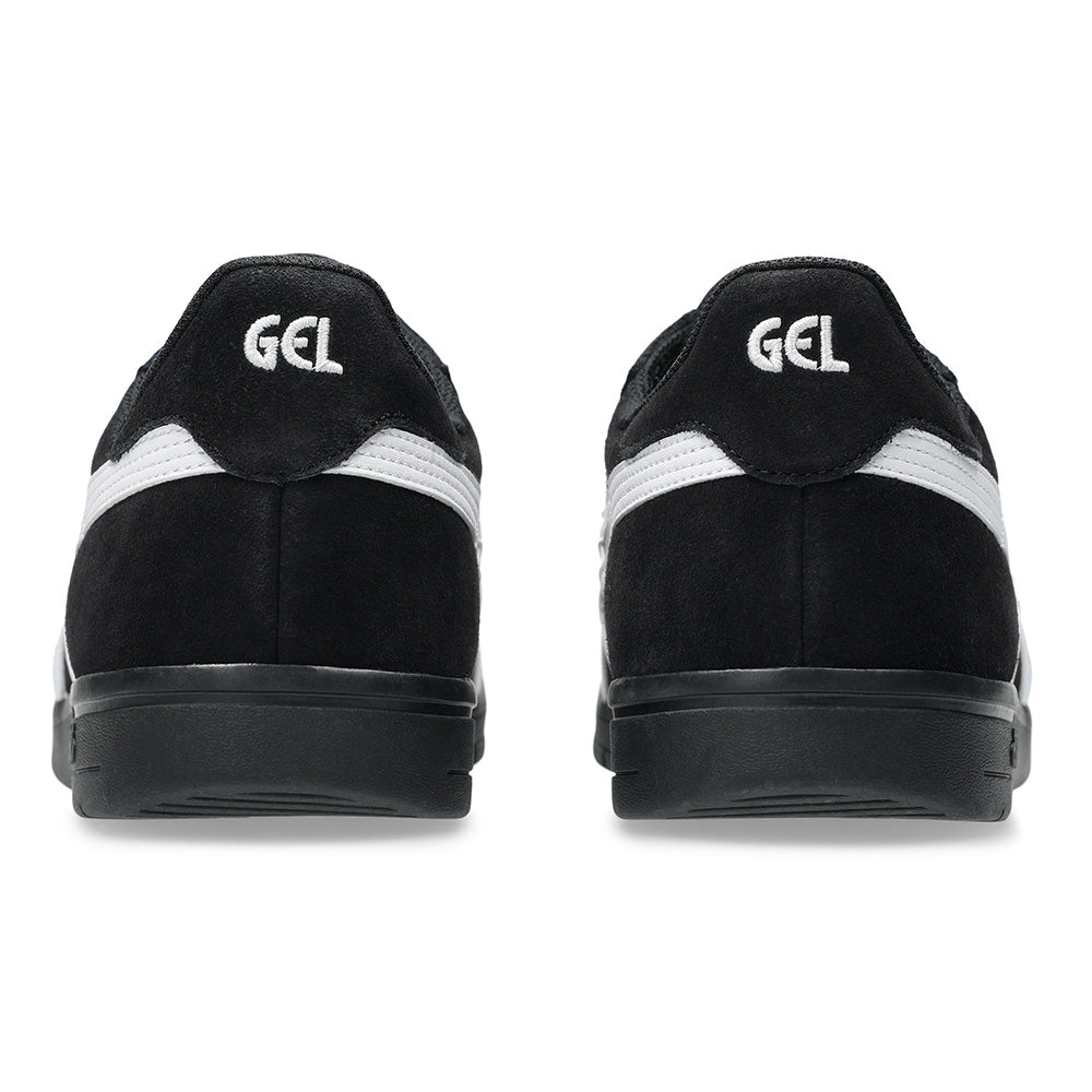 Rear view of ASICS GEL-VICKKA PRO BLACK / BRIGHT WHITE shoes by ASICS, showcasing black uppers, white "GEL" heel text, the iconic white stripe on the side, and advanced GEL technology for superior comfort.