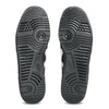 Bottom view of ASICS GEL-VICKKA PRO BLACK / BRIGHT WHITE skate shoes, showing patterned rubber soles with circular treads and the ASICS logo, highlighting advanced GEL technology for superior comfort.