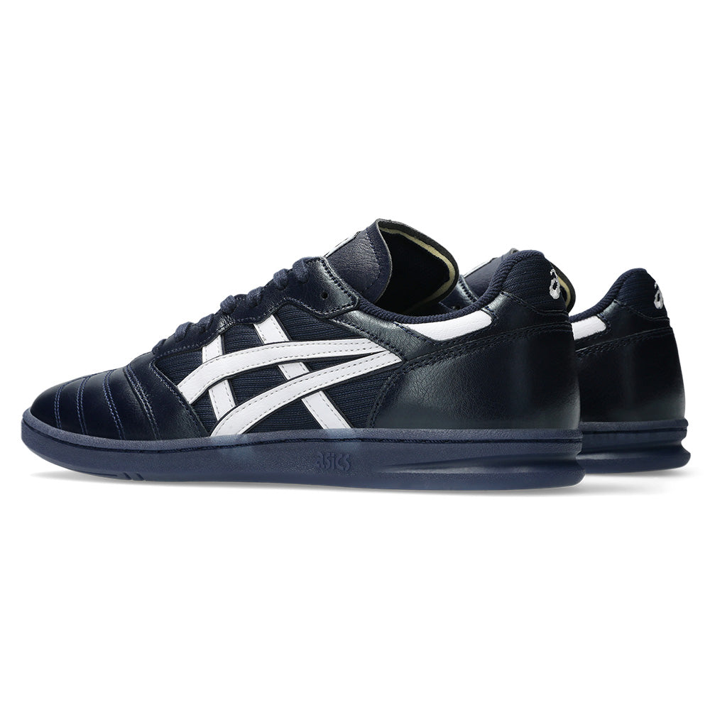A pair of ASICS LEGGEREZZA FB sneakers in navy and white, featuring a low-top design, premium leather side stripes, and rubber soles, shown from a rear side angle.