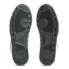 Pair of black rubber outsoles with circular tread patterns and ASICS logo, made for the ASICS JAPAN PRO MID WHITE / BLACK skateboarding shoe, shown from below against a white background.