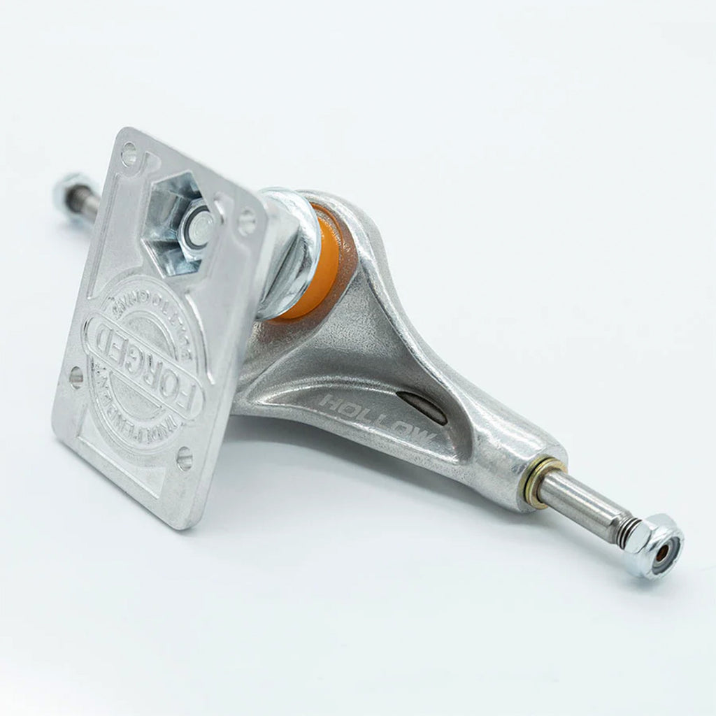 The INDEPENDENT MID 144 FORGED HOLLOW TRUCKS (SET OF TWO) features "Hollow" text on the metal body and "Torgued" text engraved on the forged baseplate, all set against a white background.