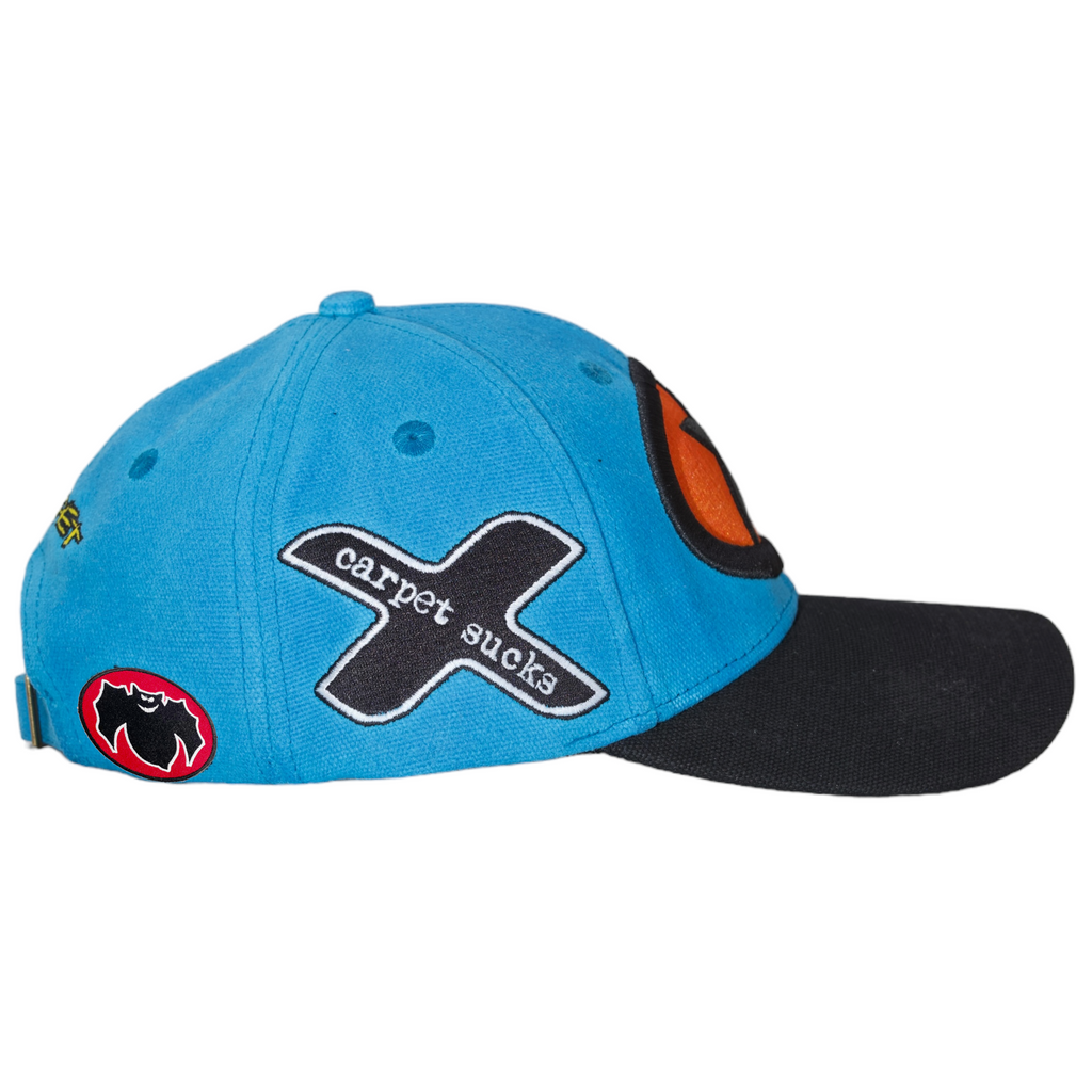 A CARPET RACING HAT CYAN with an x on it.