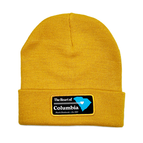 The BLUETILE HEART OF COLUMBIA PATCH BEANIE MUSTARD is the heart of Columbia beanie.