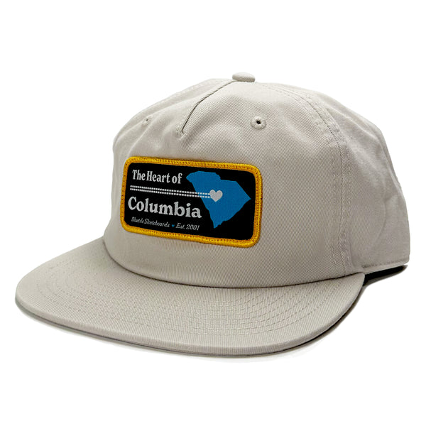 An adjustable BLUETILE HEART OF COLUMBIA PATCH HAT BONE with the state of Columbia printed on it by Bluetile Skateboards.