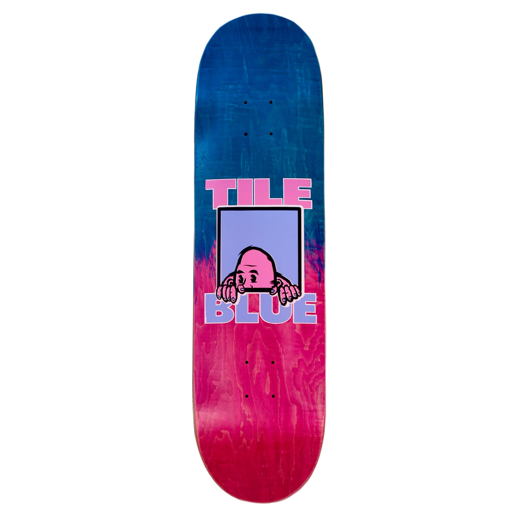 The BLUETILE W.T.F. DECK from Bluetile Skateboards boasts a gradient blue to pink design featuring Jay Croft's artwork of a character peeking over a ledge. Below the character, the text "TILE BLUE" is printed, highlighting the distinctive style of Bluetile Printshop.