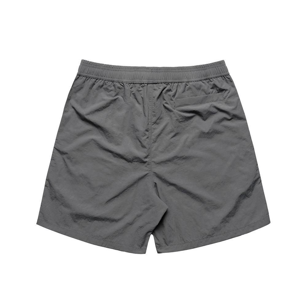 The BLUETILE LOGO SWIM SHORTS SHADOW by Bluetile Skateboards are gray, feature an elastic waistband, a single back pocket, and are made from quick-dry fabric, shown flat on a white background.