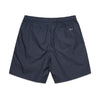 A pair of dark blue, knee-length shorts made from 100% cotton, featuring an elastic waistband and a small BLUETILE SURPLUS V3 BEACH SHORT PETRO BLUE logo on the back from Bluetile Skateboards.