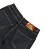 BLUETILE BRAND DENIM RUTLEDGE SHORTS BLACK by Bluetile Skateboards shown from the back, feature two rear pockets, a colorful rectangular waistband patch, and a loose fit for a relaxed, casual denim shorts style.