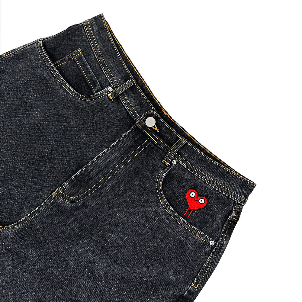 BLUETILE BRAND DENIM RUTLEDGE SHORTS BLACK by Bluetile Skateboards feature a loose fit, dark denim with yellow stitching, and custom red heart-with-eyes embroidery above the front right pocket.