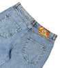 A pair of blue Bluetile Skateboards Rutledge Jorts shown from the back, featuring two rear pockets, a colorful waistband label, and a loose fit.