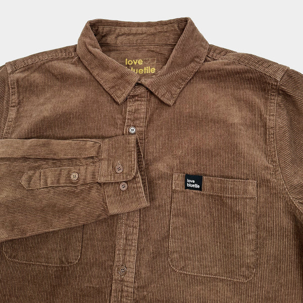A BLUETILE "LOVE BLUETILE" CORDUROY BUTTON UP WALNUT shirt with a pocket on the front. (Brand: Bluetile Skateboards)