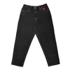 The Bluetile Skateboards BLUETILE BRAND DENIM RUTLEDGE PANT BLACK is a loose-fit black denim with a red heart patch embroidered on the front right pocket, shown against a white background.